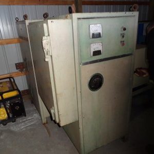 A large metal cabinet with two doors and one door open.