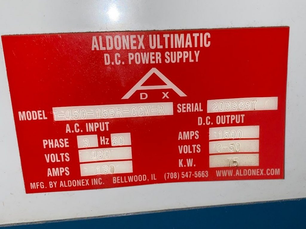 A red and white sign with electrical information.