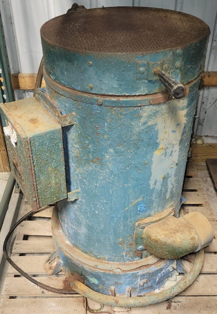Old rusty blue industrial drum machine