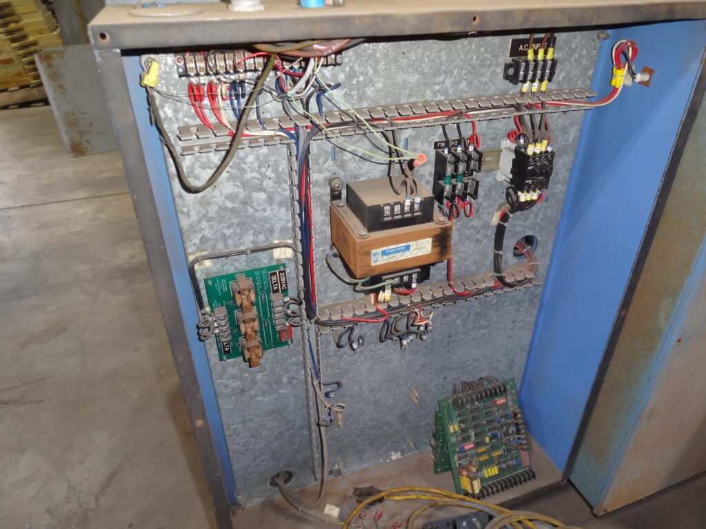 Open industrial electrical control panel with wiring