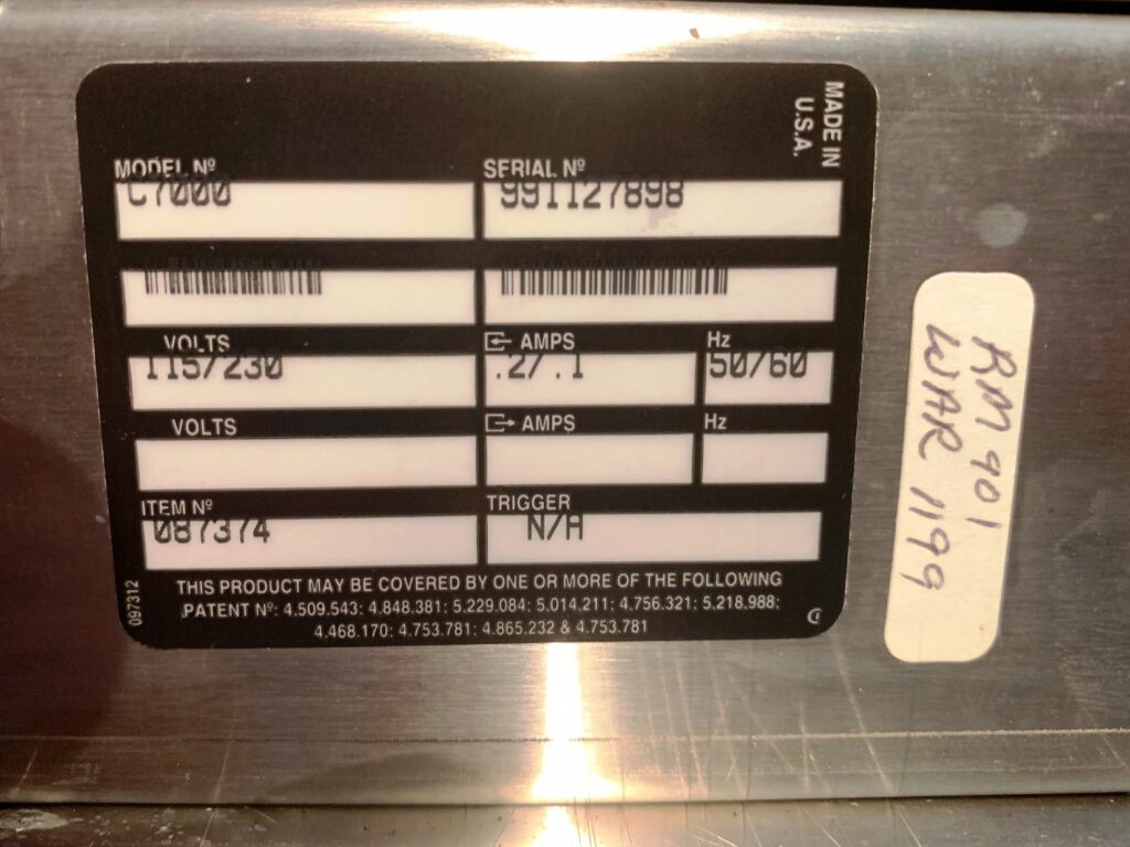 Equipment data plate showing model and serial numbers